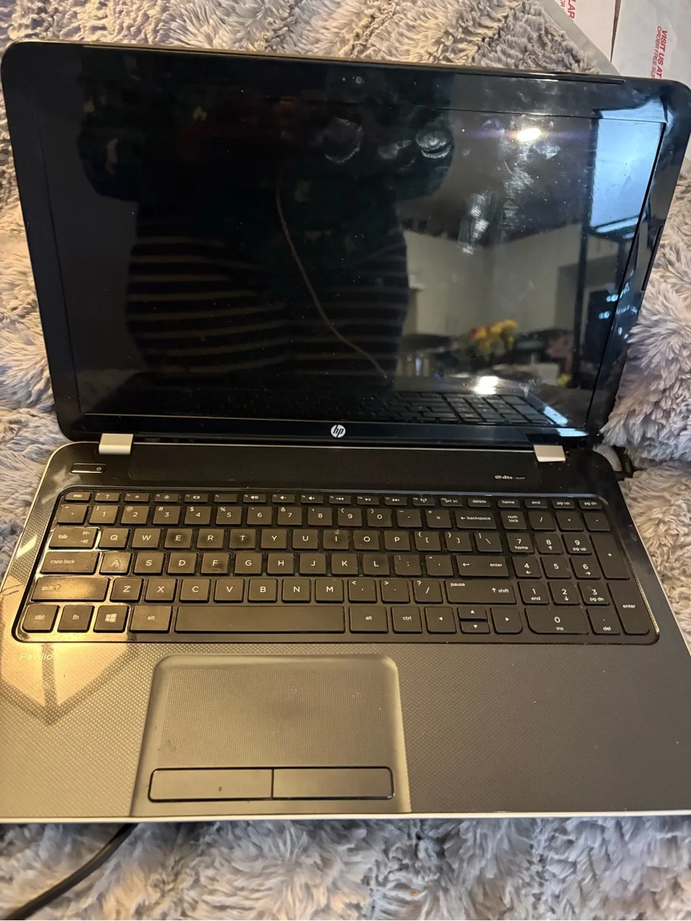 HP Black Laptop with Glossy Black Bezel and Matte Black Keyboard